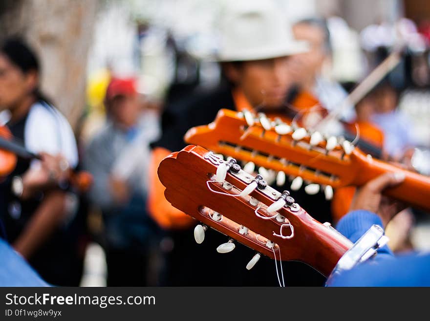 Person Playing Guitar During Daytime