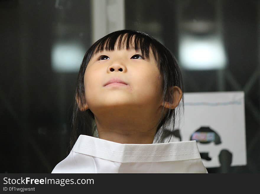 Black Haired Girl on White Shirt