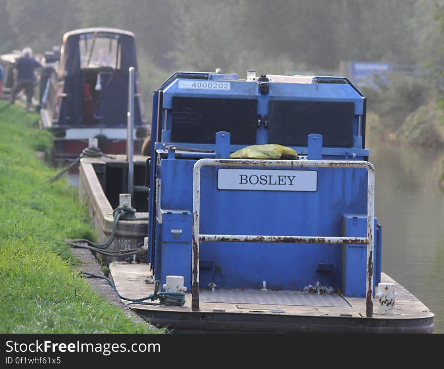 Bosley boat tied to waterfront on sunny day. Bosley boat tied to waterfront on sunny day.