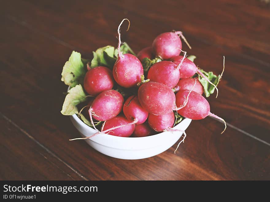 A bowl of fresh red radishes. A bowl of fresh red radishes.