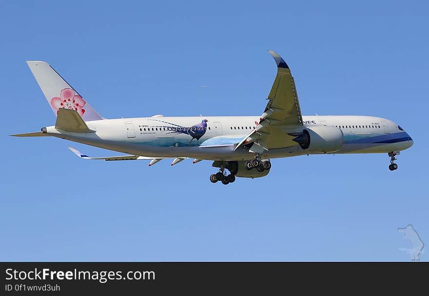 An airplane flying through a cloudless sky. An airplane flying through a cloudless sky.