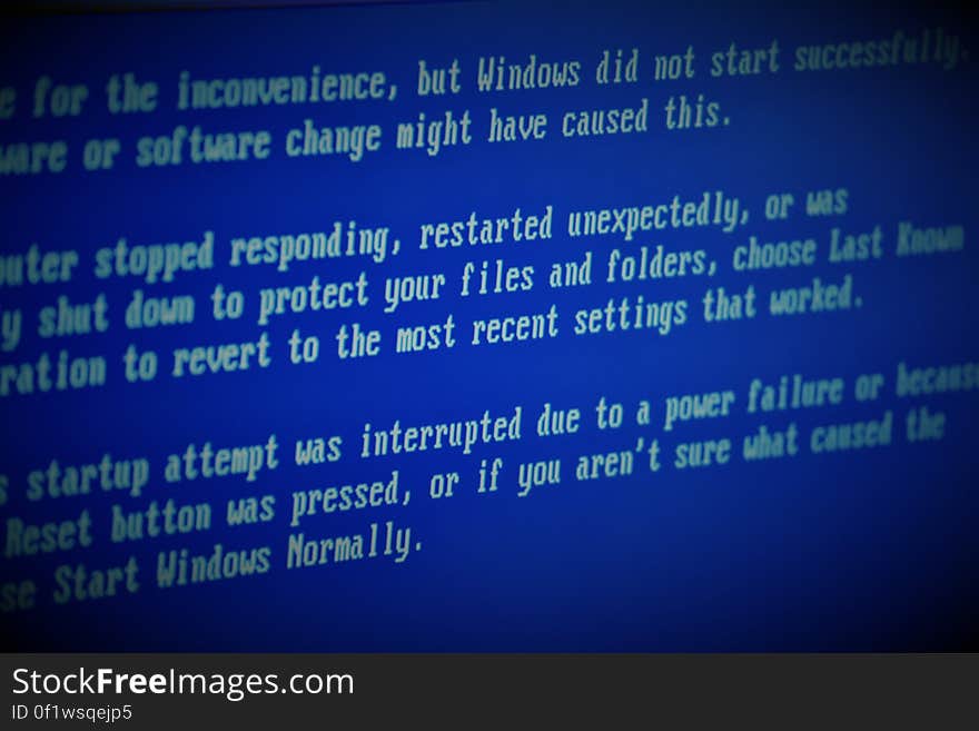 A system error notification on a blue computer screen. A system error notification on a blue computer screen.