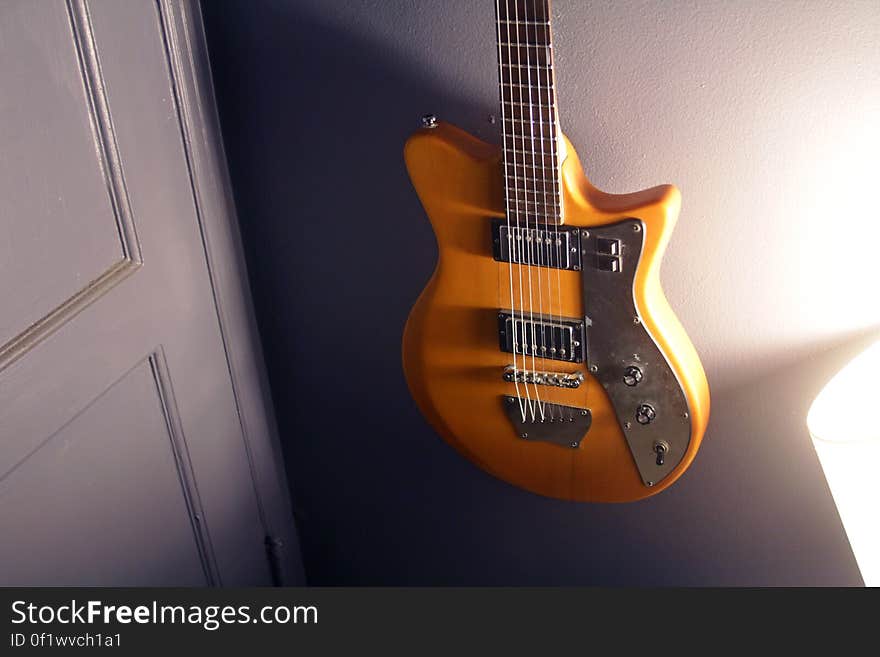 Brown and Black Electric Guitar