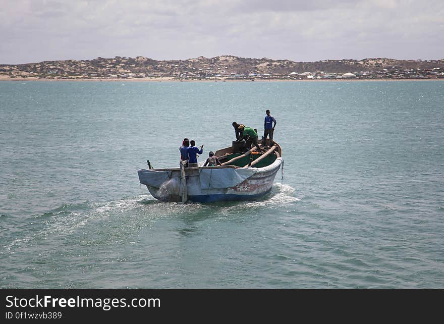 SOMALIA, Kismayo: In a photograph taken 15 July 2013 and released by the African Union-United Nations Information Support Team 22 July, a boat that transport food and produce is seen in the harbour of Kismayo seaport in southern Somalia. AU-UN IST PHOTO / RAMADAN MOHAMED HASSAN. SOMALIA, Kismayo: In a photograph taken 15 July 2013 and released by the African Union-United Nations Information Support Team 22 July, a boat that transport food and produce is seen in the harbour of Kismayo seaport in southern Somalia. AU-UN IST PHOTO / RAMADAN MOHAMED HASSAN.