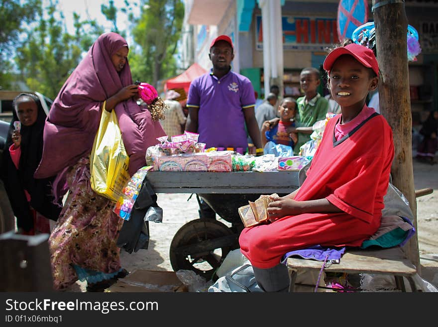 A woman shops at a roadside stall in Hamar Weyne market in the Somali capital Mogadishu, 05 August, 2013. 06 August marks 2 years since the Al Qaeda-affiliated extremist group Al Shabaab withdrew from Mogadishu following sustained operations by forces of the Somali National Army &#x28;SNA&#x29; backed by troops of the African Union Mission in Somalia &#x28;AMISOM&#x29; to retake the city. Since the group&#x27;s departure the country&#x27;s captial has re-established itself and a sense of normality has returned. Buildings and infrastructure devastated and destroyed by two decades of conflict have been repaired; thousands of Diaspora Somalis have returned home to invest and help rebuild their nation; foreign embassies and diplomatic missions have reopened and for the first time in many years, Somalia has an internationally recognised government.. AU-UN IST PHOTO / STUART PRICE. A woman shops at a roadside stall in Hamar Weyne market in the Somali capital Mogadishu, 05 August, 2013. 06 August marks 2 years since the Al Qaeda-affiliated extremist group Al Shabaab withdrew from Mogadishu following sustained operations by forces of the Somali National Army &#x28;SNA&#x29; backed by troops of the African Union Mission in Somalia &#x28;AMISOM&#x29; to retake the city. Since the group&#x27;s departure the country&#x27;s captial has re-established itself and a sense of normality has returned. Buildings and infrastructure devastated and destroyed by two decades of conflict have been repaired; thousands of Diaspora Somalis have returned home to invest and help rebuild their nation; foreign embassies and diplomatic missions have reopened and for the first time in many years, Somalia has an internationally recognised government.. AU-UN IST PHOTO / STUART PRICE.