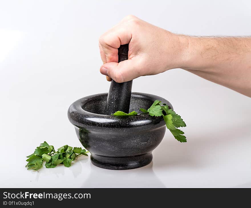 Human Holding Black Ceramic Pestle