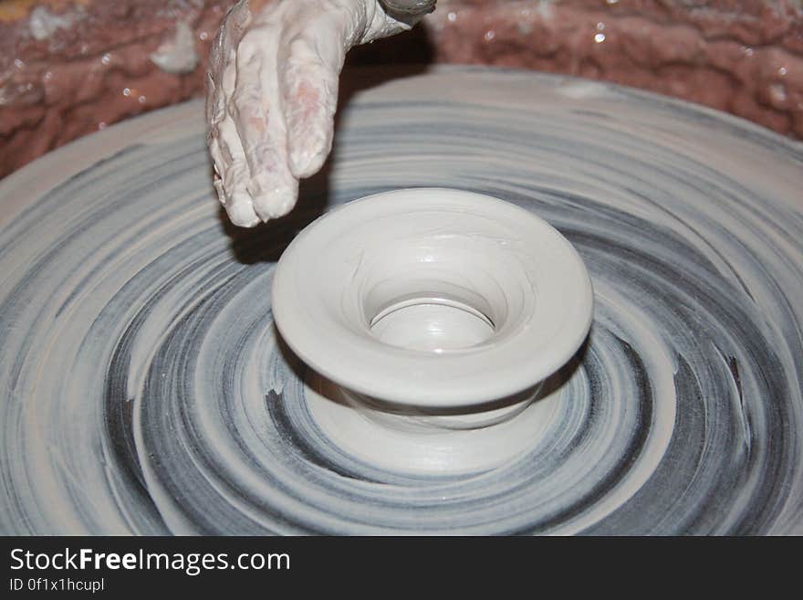 Person Making Clay Pot