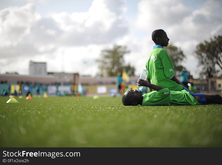 Two children take a break from training at the FIFA Football Festival in Mogadishu, Somalia, on August 19. FIFA, having had no presence in Somalia for the last 26 years, today held its first training session in Mogadishu since the country fell into civil war. Illegal under al Shabab, football has made a huge comeback in Somalia, with Mogadishu&#x27;s streets literally filling up with children each afternoon as they come out to play the game. AU UN IST PHOTO / TOBIN JONES. Two children take a break from training at the FIFA Football Festival in Mogadishu, Somalia, on August 19. FIFA, having had no presence in Somalia for the last 26 years, today held its first training session in Mogadishu since the country fell into civil war. Illegal under al Shabab, football has made a huge comeback in Somalia, with Mogadishu&#x27;s streets literally filling up with children each afternoon as they come out to play the game. AU UN IST PHOTO / TOBIN JONES.