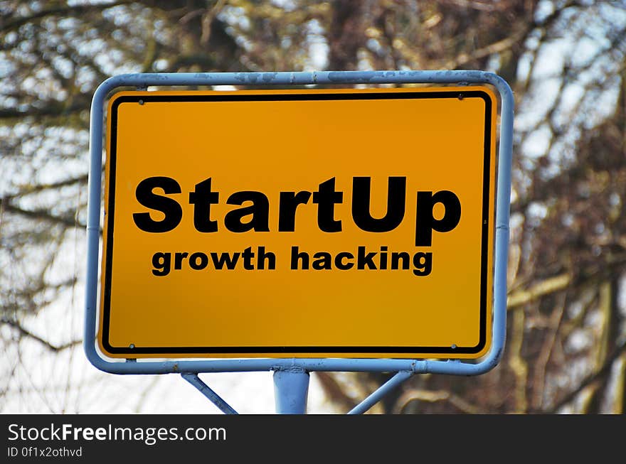 Yellow and Black Start Up Growth Hacking Signage