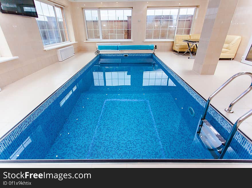 A small indoor swimming pool. A small indoor swimming pool.