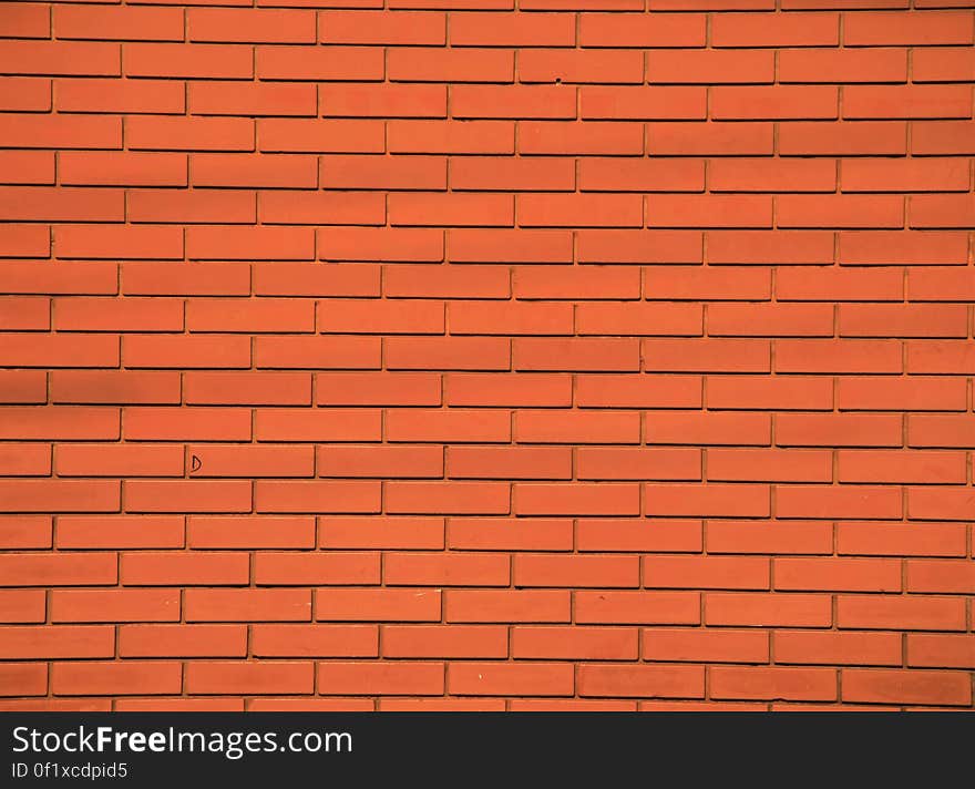 Bright orange brick building wall. Bright orange brick building wall.