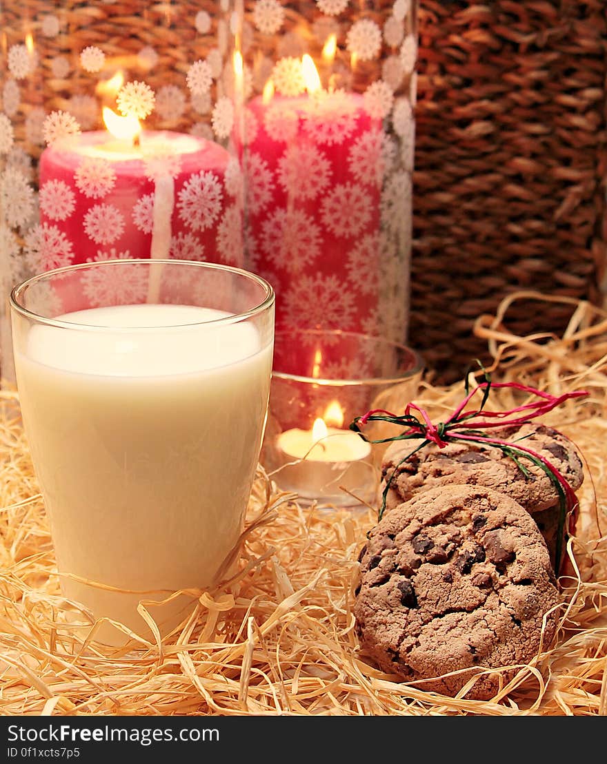 Clear Glass Candle Holder Beside the Brown and Brown Cookie