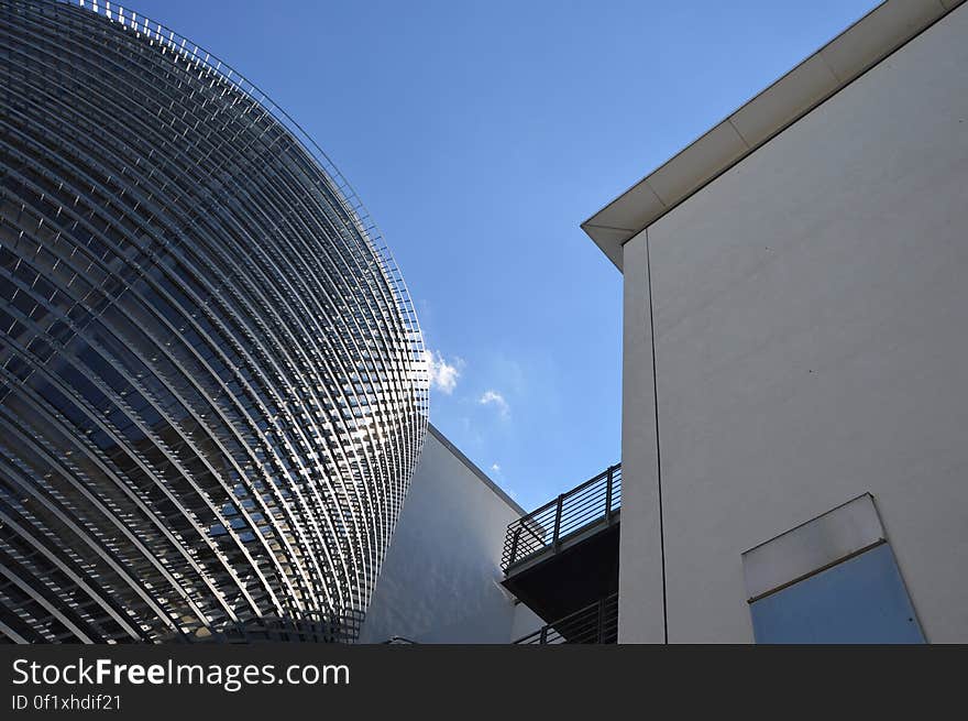 Low angle perspective view of modern buildings in city. Low angle perspective view of modern buildings in city.