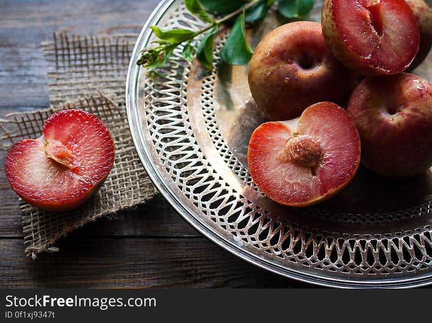 Sliced Plums on Silver Round Platter