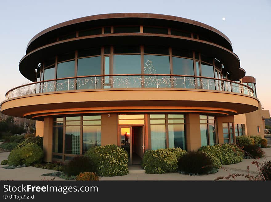 A modern house with round glass walls.