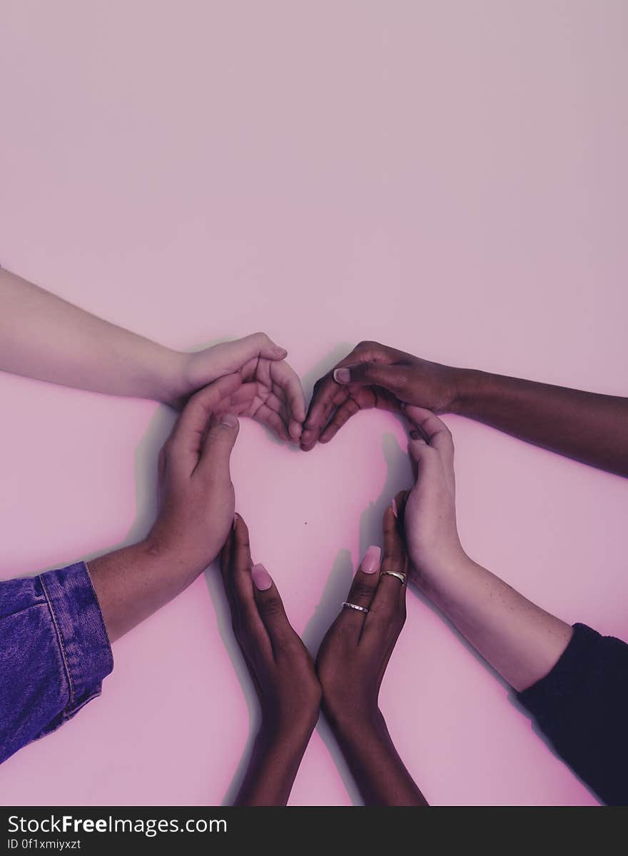 People`s hands making the shape of heart on a wall. People`s hands making the shape of heart on a wall.