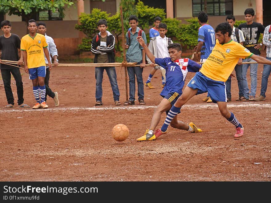 Two teams playing soccer in India. Two teams playing soccer in India.