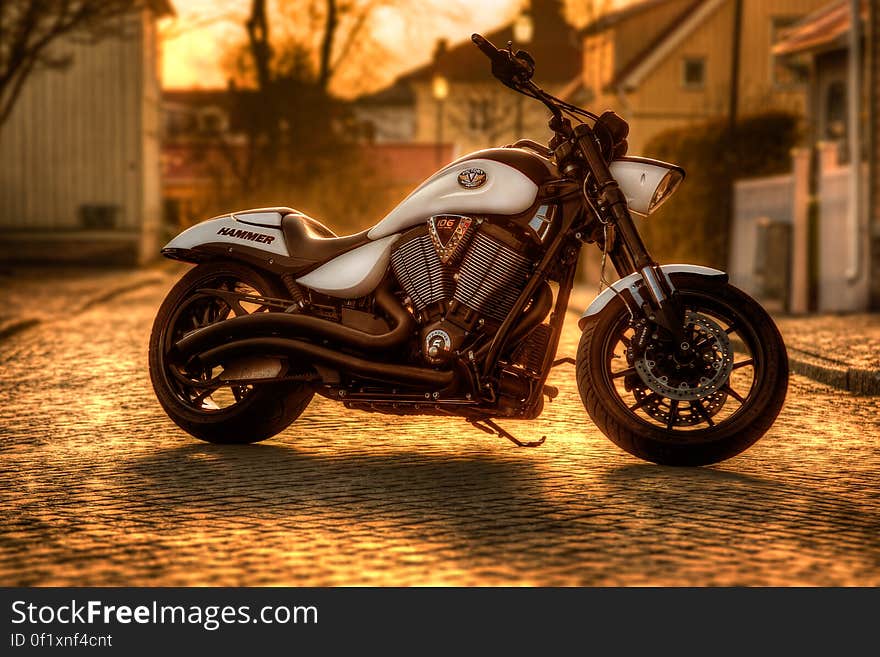 A motorbike parked on a cobbled street. A motorbike parked on a cobbled street.