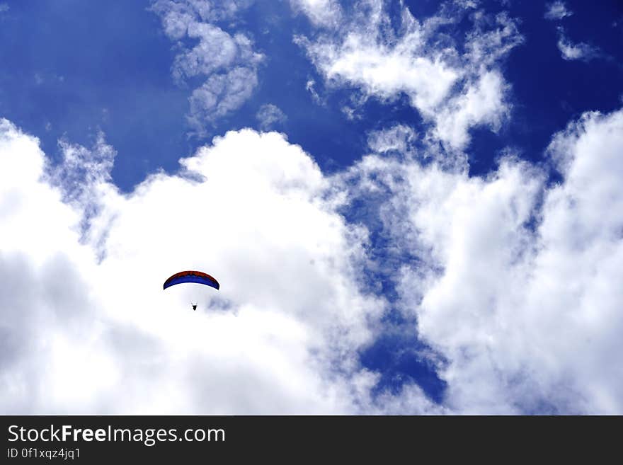 Low Angle View of Paragliding Against Sky