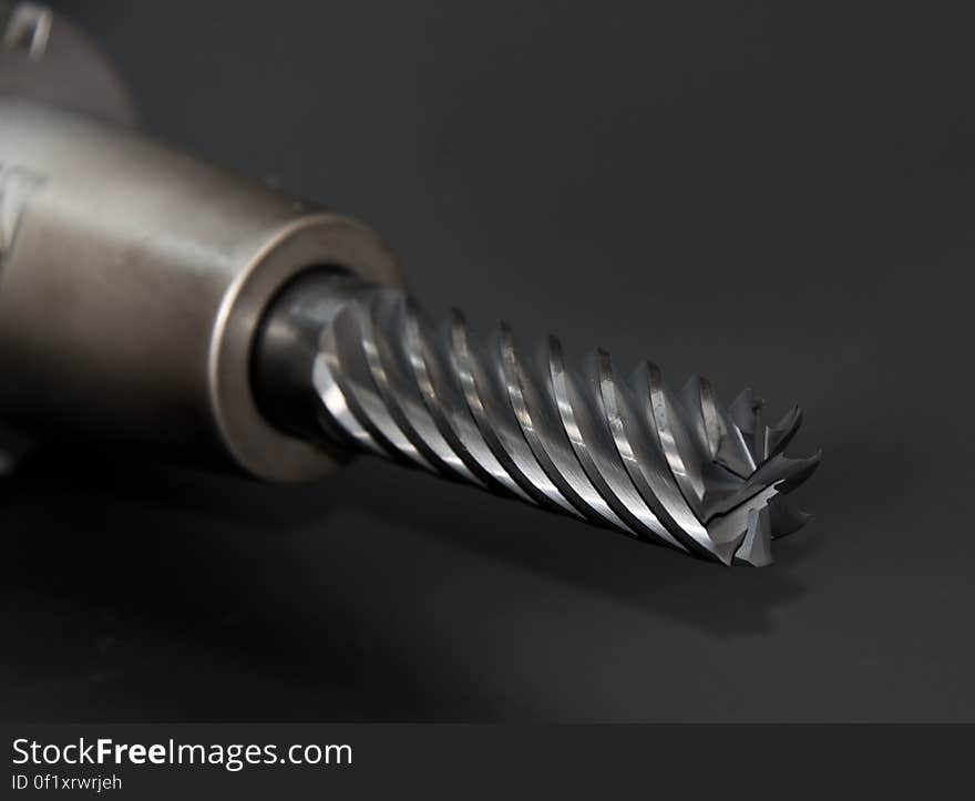 A close up of a metal mill bit.