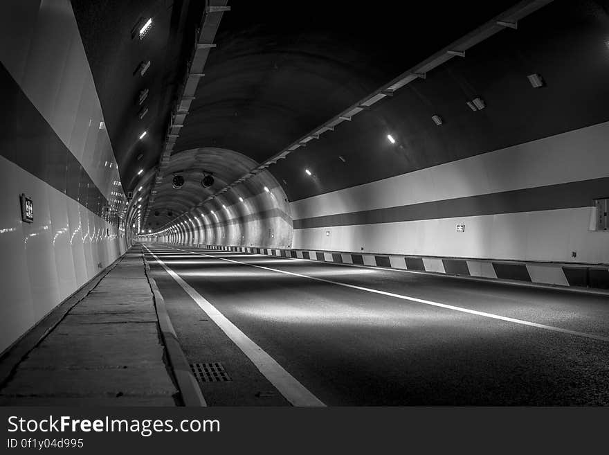 A road passing through a tunnel. A road passing through a tunnel.