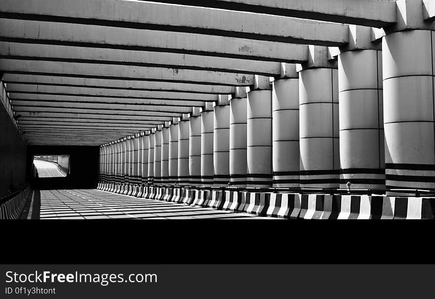 Grayscale Photo of Concrete Pathway