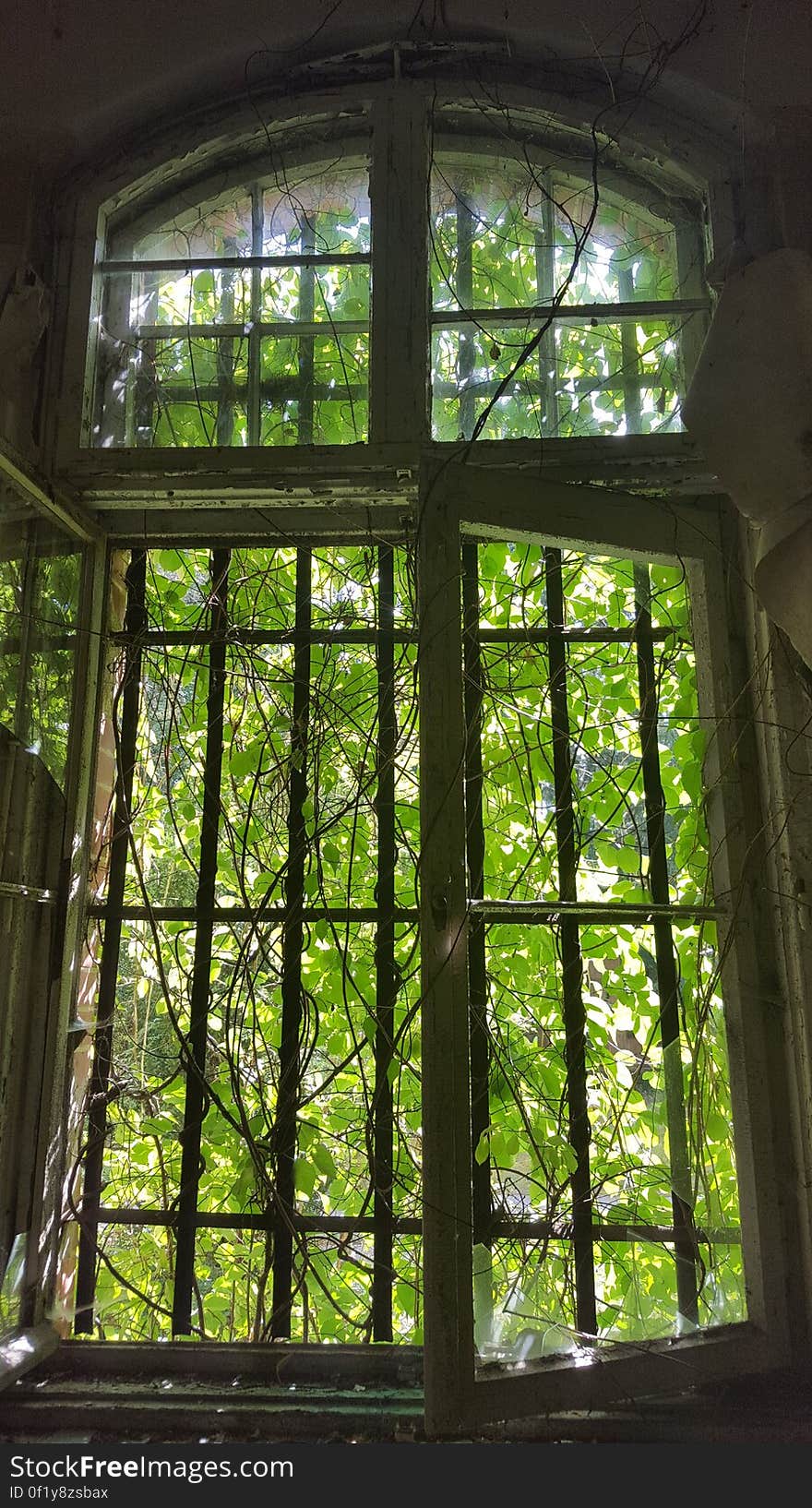 An old window of an abandoned dilapidated house. An old window of an abandoned dilapidated house.