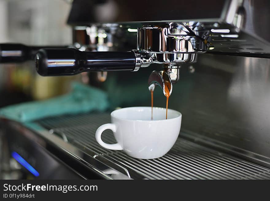 A professional coffee machine brewing a cup of coffee. A professional coffee machine brewing a cup of coffee.