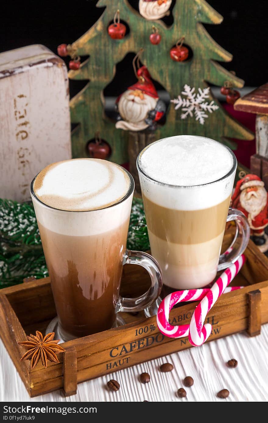 A pair of coffee mugs with Christmas tree and other Christmas decorations. A pair of coffee mugs with Christmas tree and other Christmas decorations.