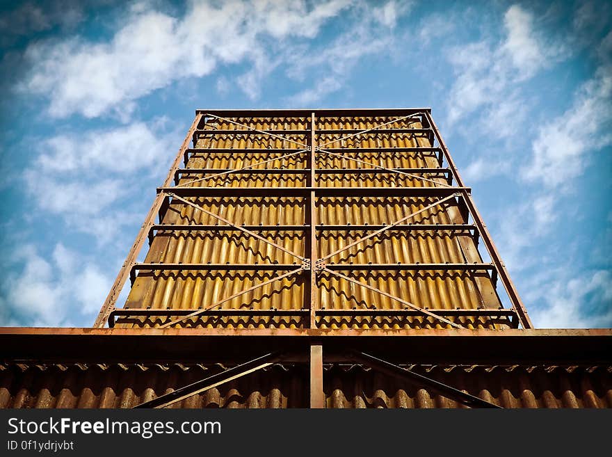 A metallic frame holding containers with corrugated metal sheets. A metallic frame holding containers with corrugated metal sheets.