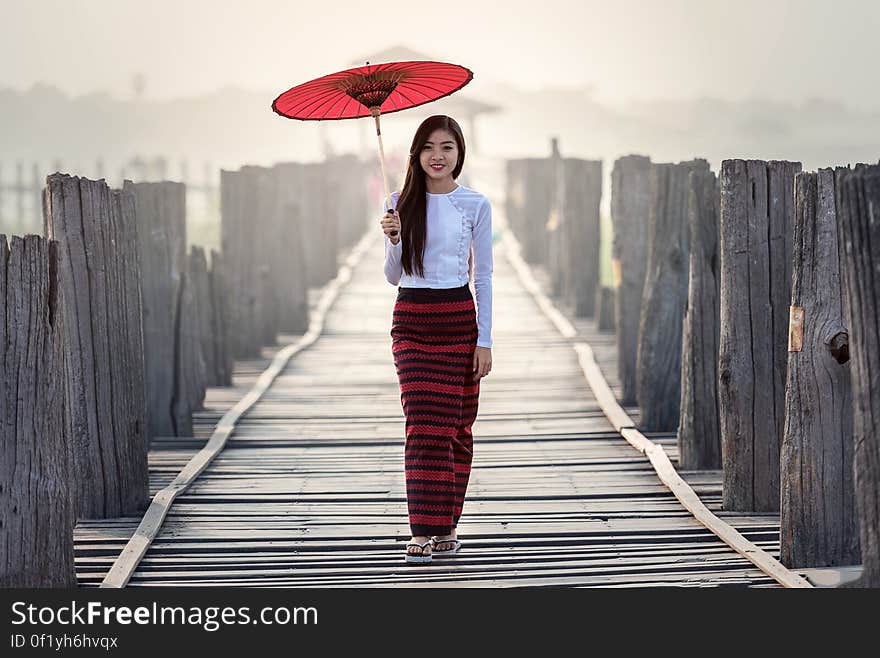 Young Woman Standing on Road in City