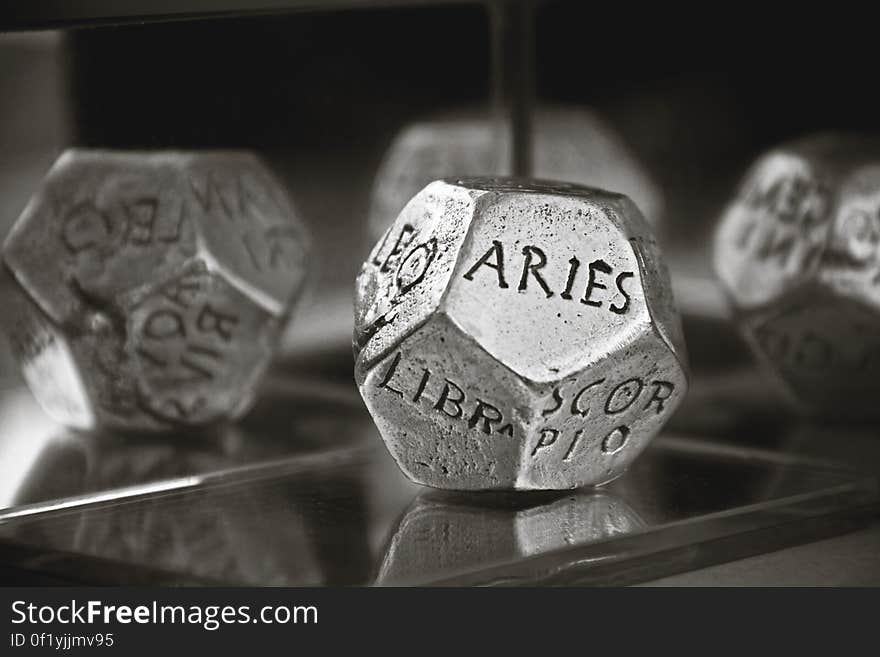 Aries Dice in Gray Scale Photography