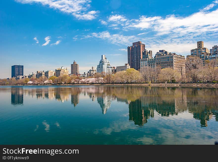 City buildings reflecting on lake surface. City buildings reflecting on lake surface.