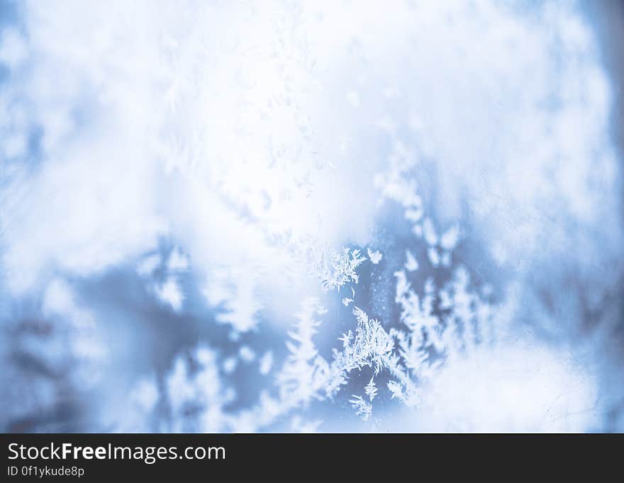 A close up shot of blurred snowflakes.