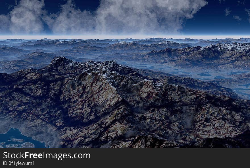 An aerial view of rocky landscape in mist.