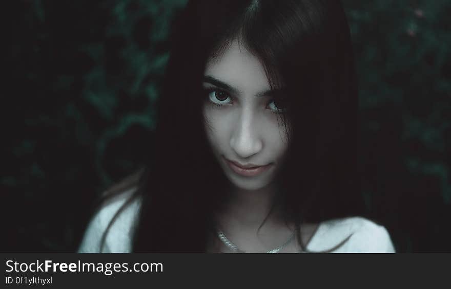 Woman Wearing White Shirt and Silver Chain Necklace