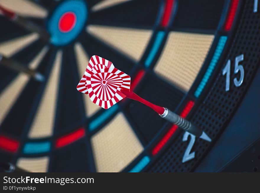 A dart stuck on a darts board. A dart stuck on a darts board.