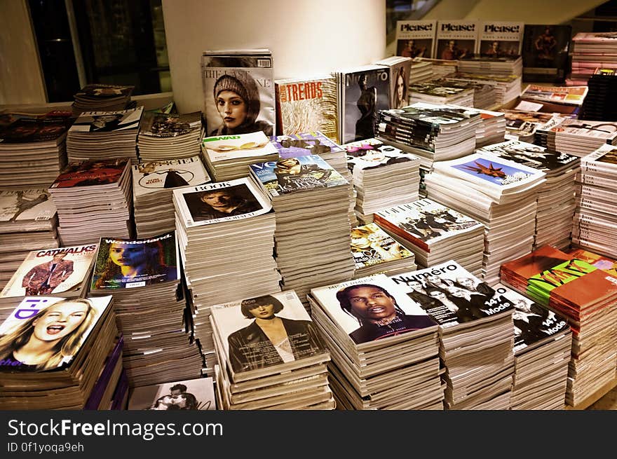 A magazine stand in a bookstore.