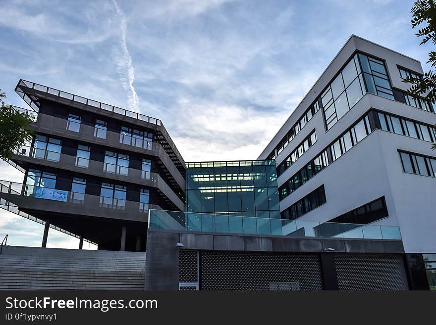 A modern building with stone, glass and wood materials.