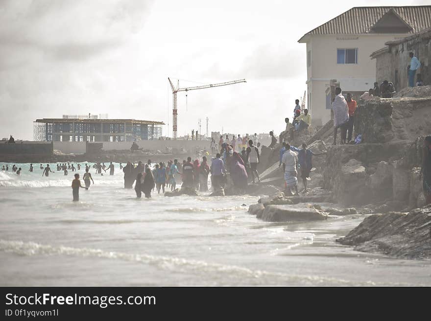 People stand in the ocean on Lido beach in Mogadishu, Somalia, during Eid al-Fitr on July 28. AMISOM Photo / Tobin Jones. People stand in the ocean on Lido beach in Mogadishu, Somalia, during Eid al-Fitr on July 28. AMISOM Photo / Tobin Jones