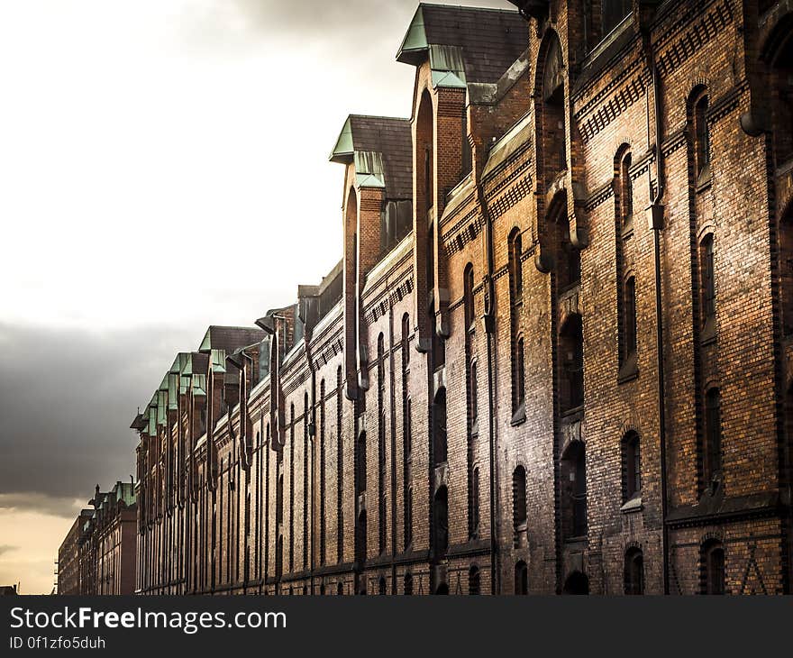 Brick building facade with arched windows.