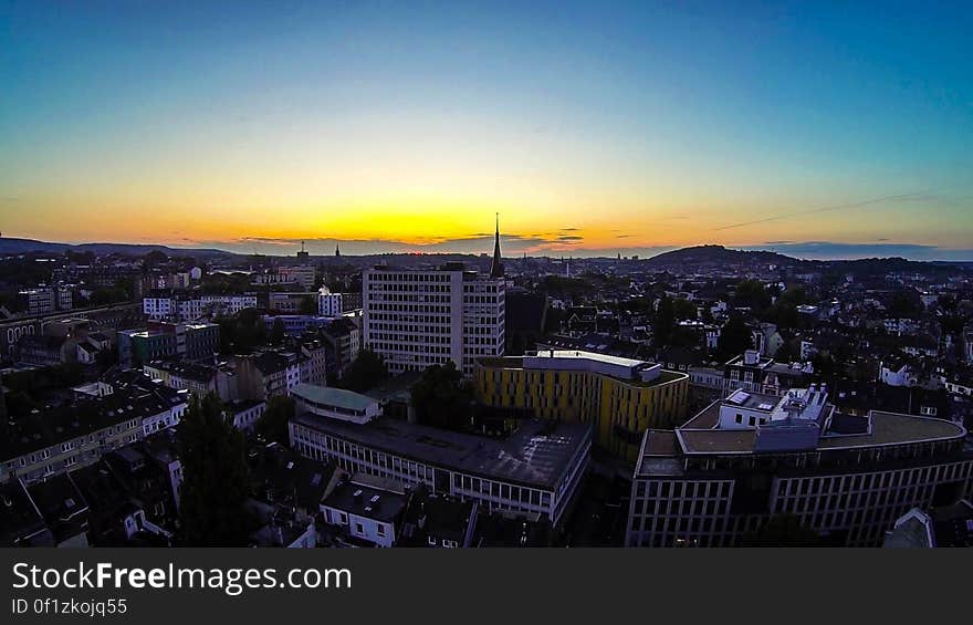 A view over a city at sunset. A view over a city at sunset.