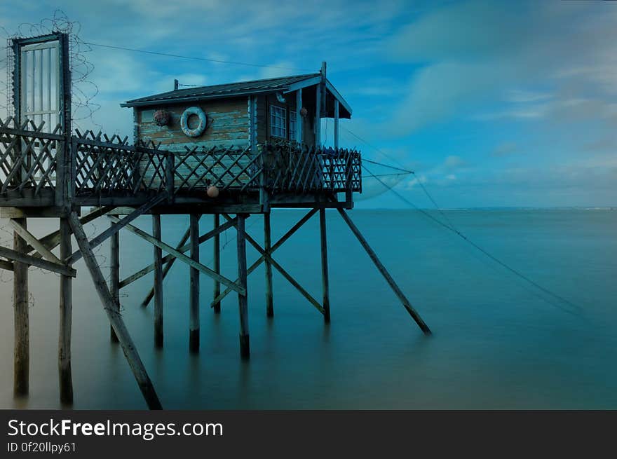 A hut on a pier by the sea. A hut on a pier by the sea.