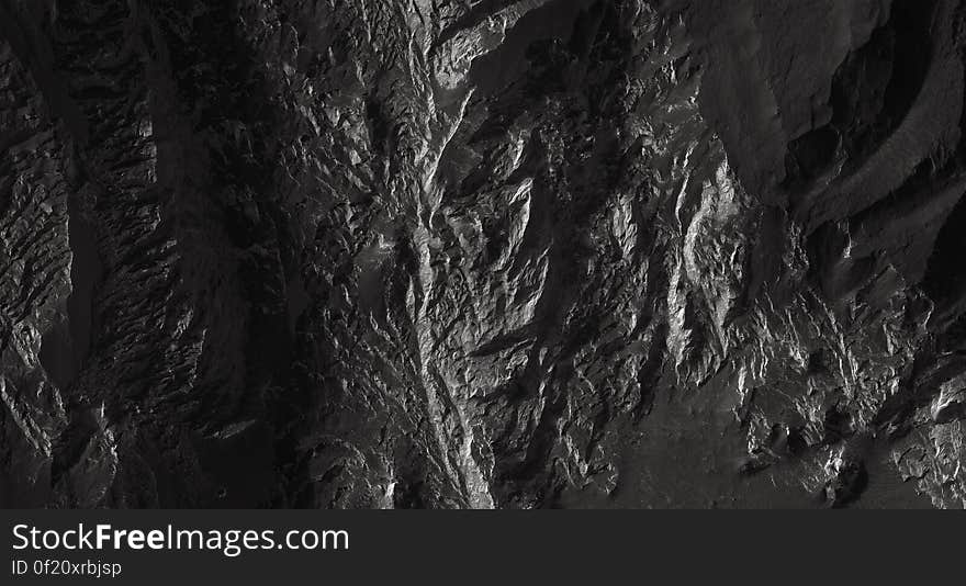 A bleak rocky background in black and white.