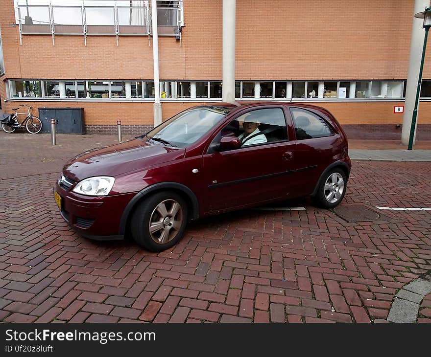 An action photo of a man driving a car. The man was just about to turn the corner. I add free new photos daily. For my full portfolio of free stock photos you can check stockypics.com