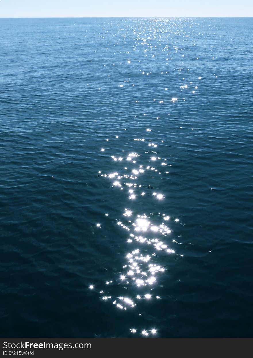 Sunlight reflecting on the still sea surface. Sunlight reflecting on the still sea surface.