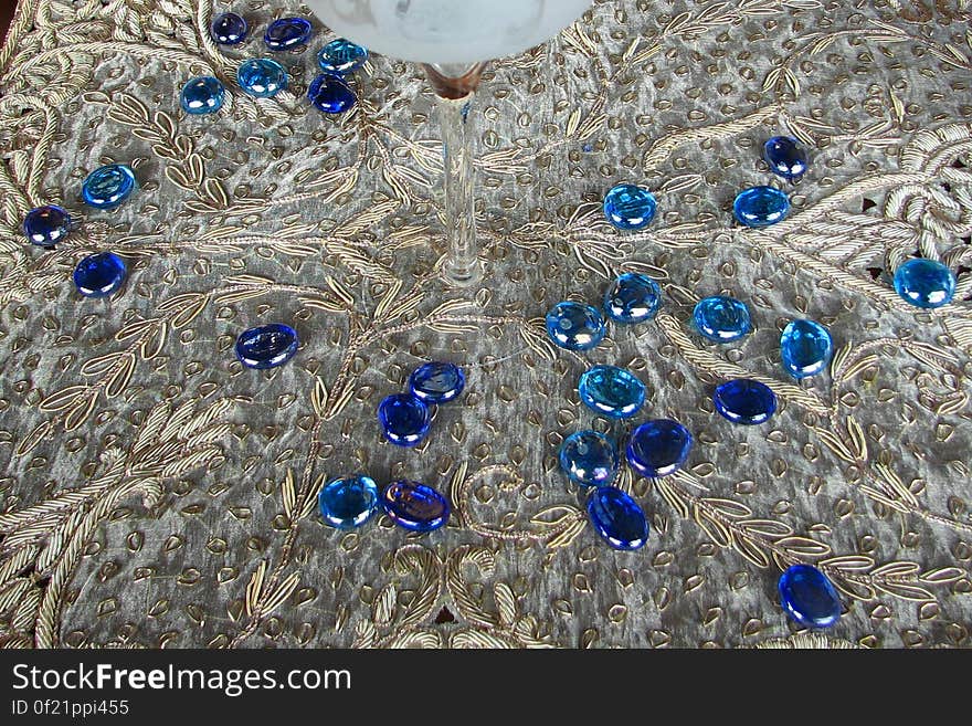 blue glass pebbles on lace