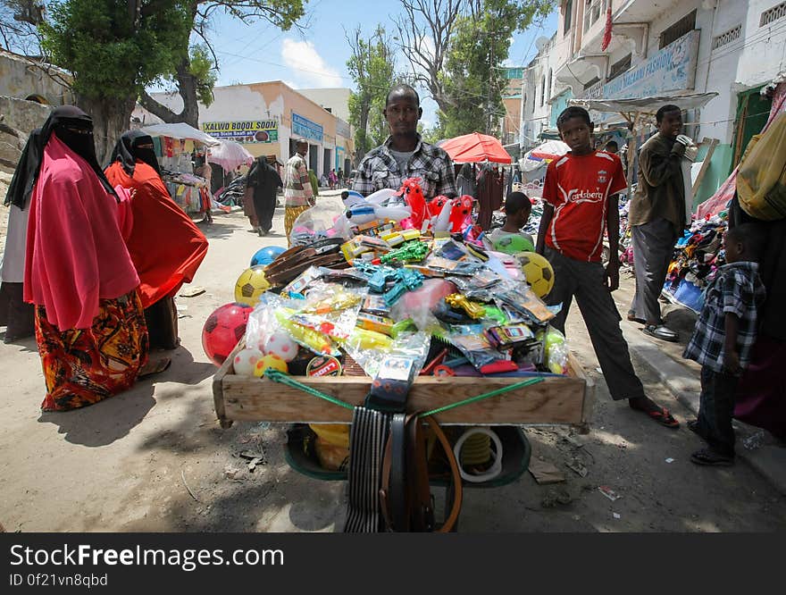 A street vendor displays his produce in Hamar Weyne market in the Somali capital Mogadishu, 05 August, 2013. 06 August marks 2 years since the Al Qaeda-affiliated extremist group Al Shabaab withdrew from Mogadishu following sustained operations by forces of the Somali National Army &#x28;SNA&#x29; backed by troops of the African Union Mission in Somalia &#x28;AMISOM&#x29; to retake the city. Since the group&#x27;s departure the country&#x27;s captial has re-established itself and a sense of normality has returned. Buildings and infrastructure devastated and destroyed by two decades of conflict have been repaired; thousands of Diaspora Somalis have returned home to invest and help rebuild their nation; foreign embassies and diplomatic missions have reopened and for the first time in many years, Somalia has an internationally recognised government.. AU-UN IST PHOTO / STUART PRICE. A street vendor displays his produce in Hamar Weyne market in the Somali capital Mogadishu, 05 August, 2013. 06 August marks 2 years since the Al Qaeda-affiliated extremist group Al Shabaab withdrew from Mogadishu following sustained operations by forces of the Somali National Army &#x28;SNA&#x29; backed by troops of the African Union Mission in Somalia &#x28;AMISOM&#x29; to retake the city. Since the group&#x27;s departure the country&#x27;s captial has re-established itself and a sense of normality has returned. Buildings and infrastructure devastated and destroyed by two decades of conflict have been repaired; thousands of Diaspora Somalis have returned home to invest and help rebuild their nation; foreign embassies and diplomatic missions have reopened and for the first time in many years, Somalia has an internationally recognised government.. AU-UN IST PHOTO / STUART PRICE.