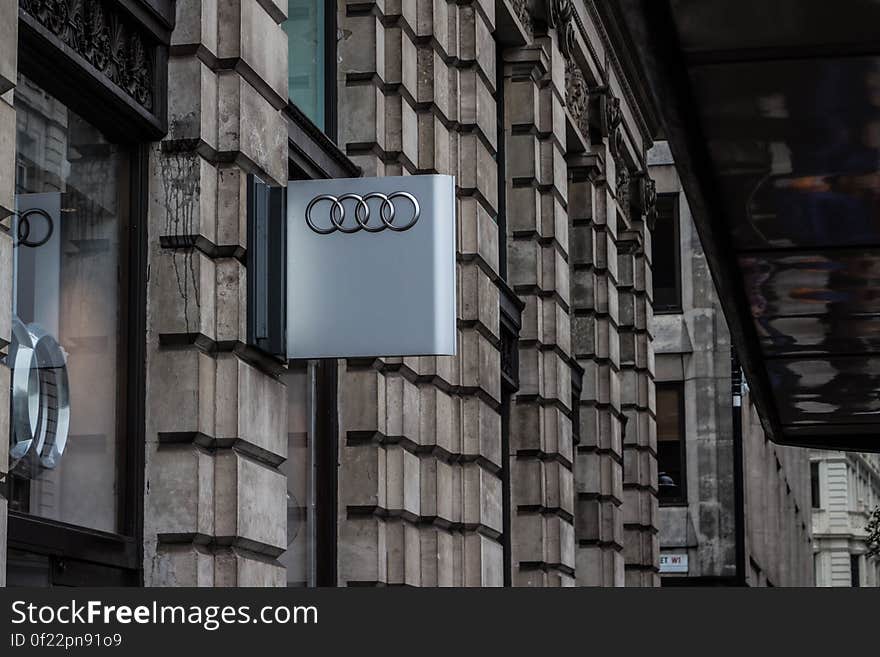 An Audi sign on the dealer's wall. An Audi sign on the dealer's wall.