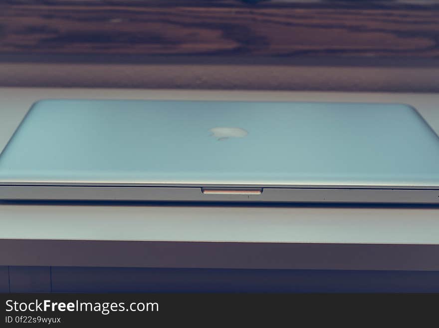 A closed laptop computer on desk.